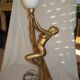 Lamp depicting a with a drape