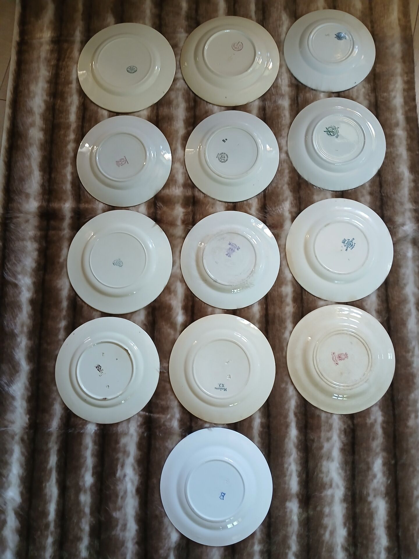 13 mismatched flat plates in ironstone