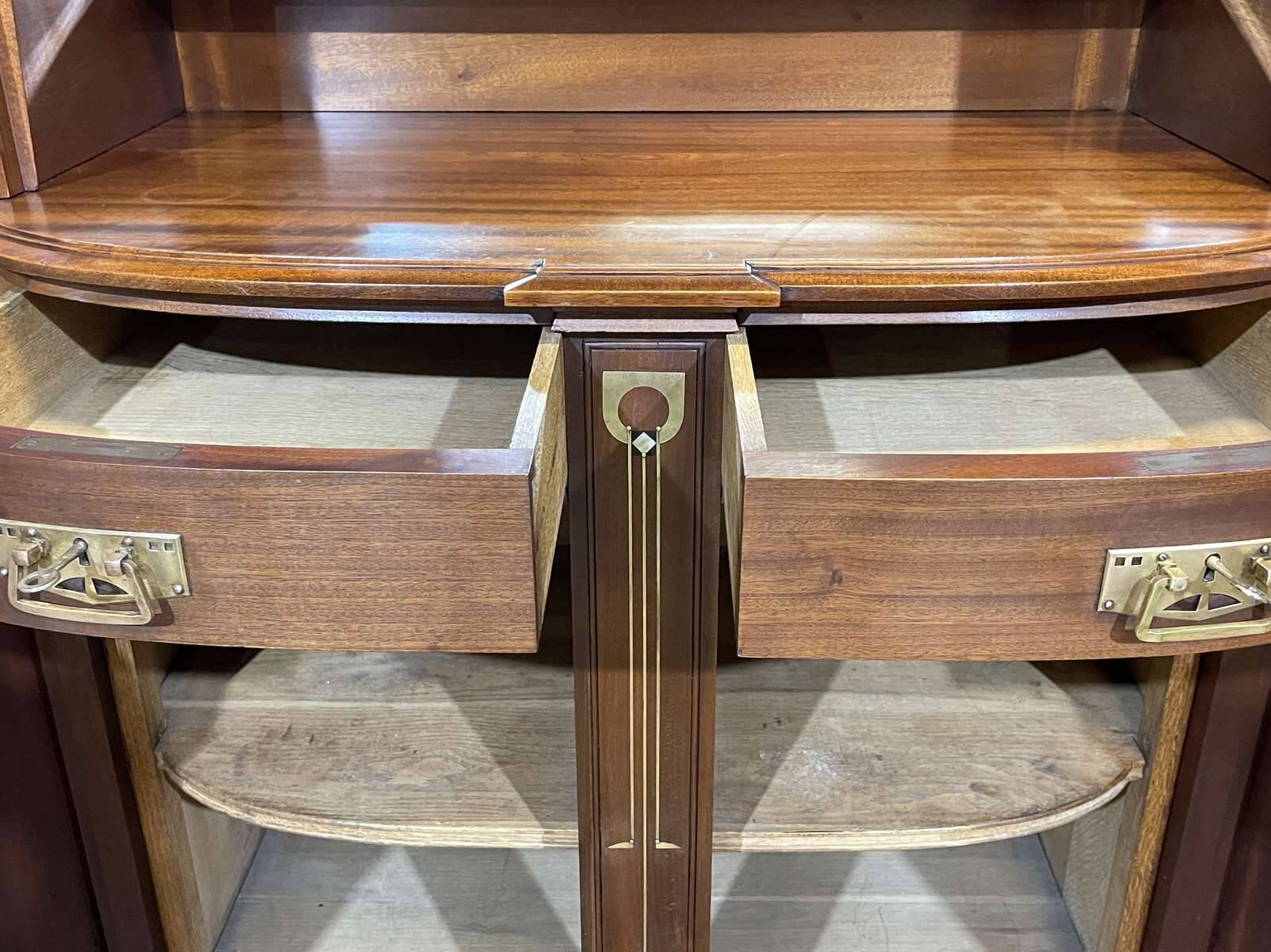 Art Nouveau mahogany buffet with clock in the style of G. Serrurier Bovy.