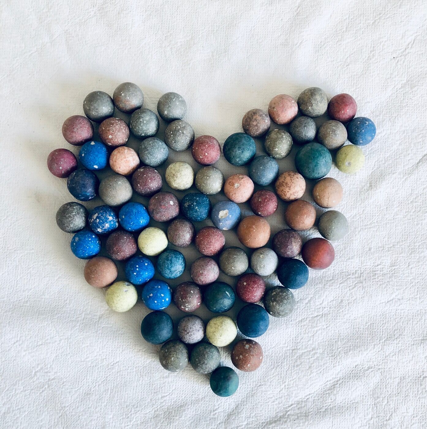 70 clay marbles and burlap bag