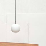 Minimalist suspended glass ball lamp from the vintage German space age by Glashütte Limburg, 1970s.