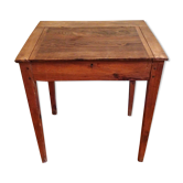 With knocking down old wooden school desk