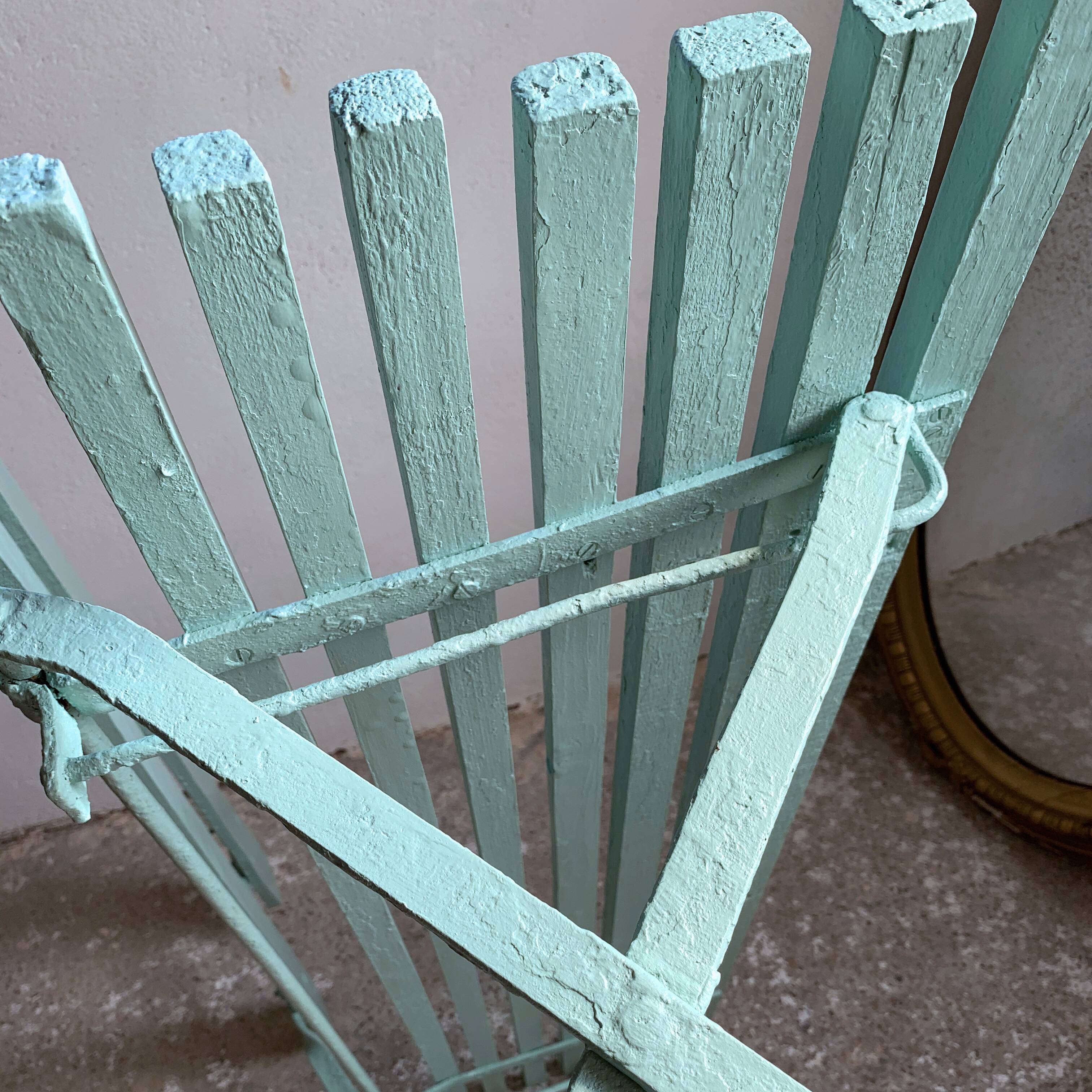 Former folding garden bench with wooden and metal slats