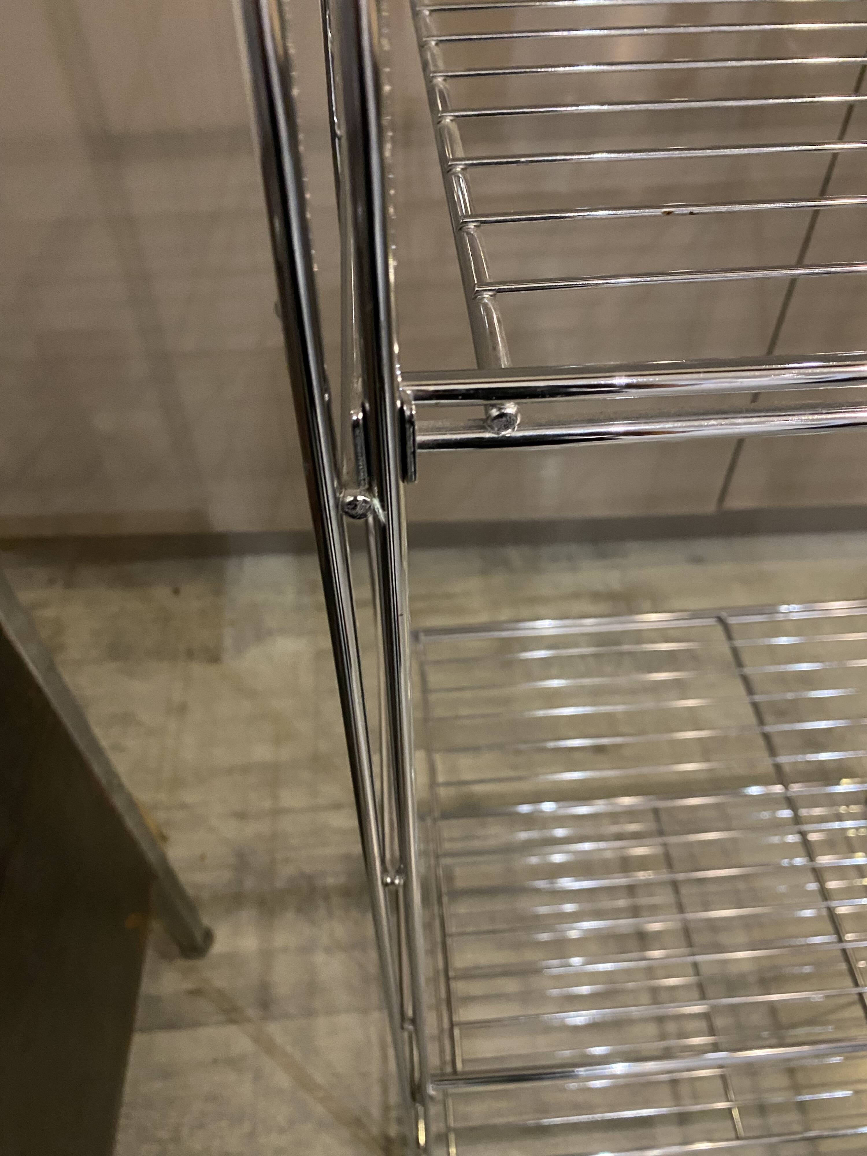 Modular wall bookshelf desk in vintage chrome.