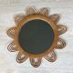 Rattan mirror representing a sun