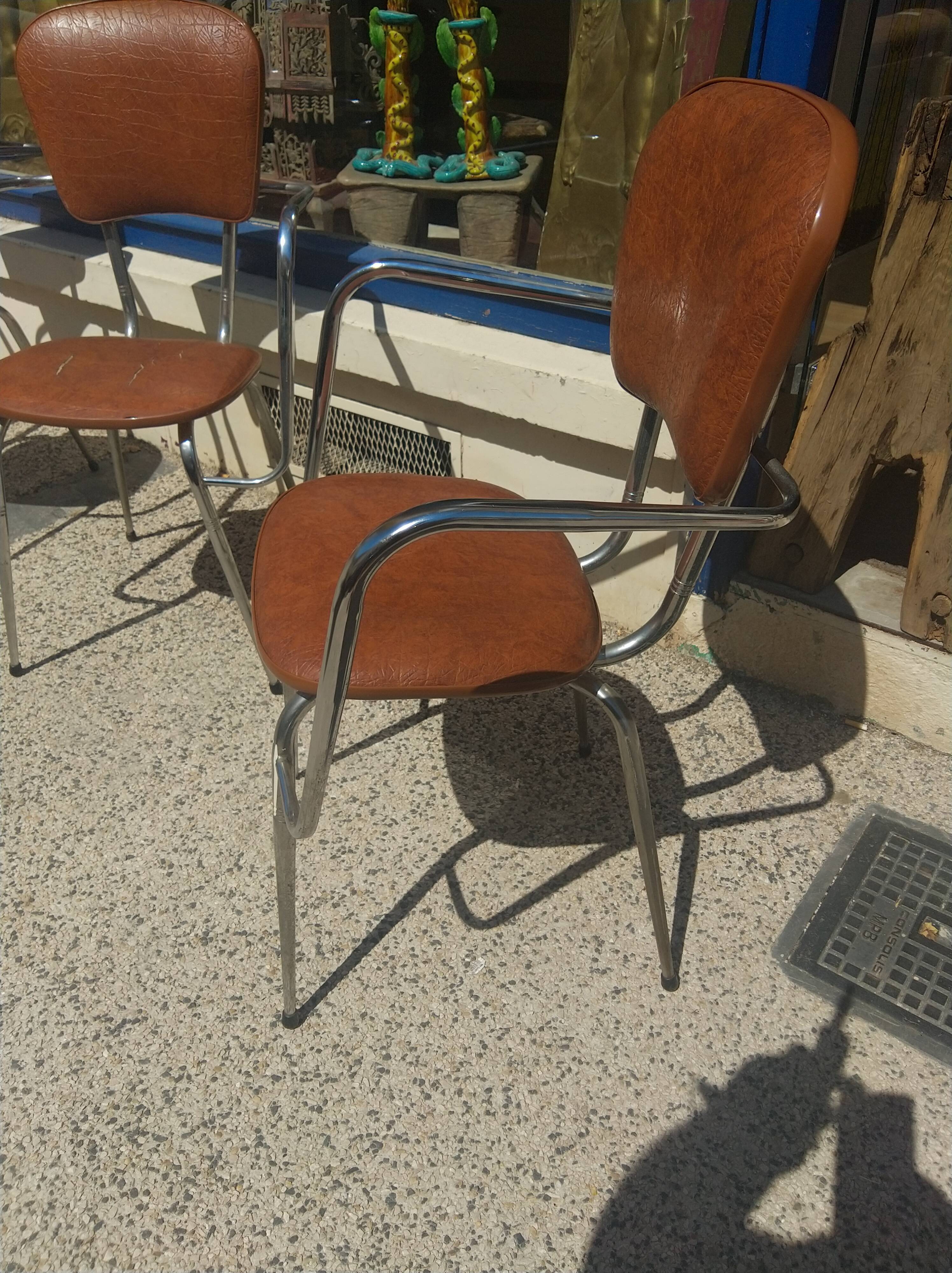 Set of 4 armchairs in chromed metal and brown imitation leather, circa 1960