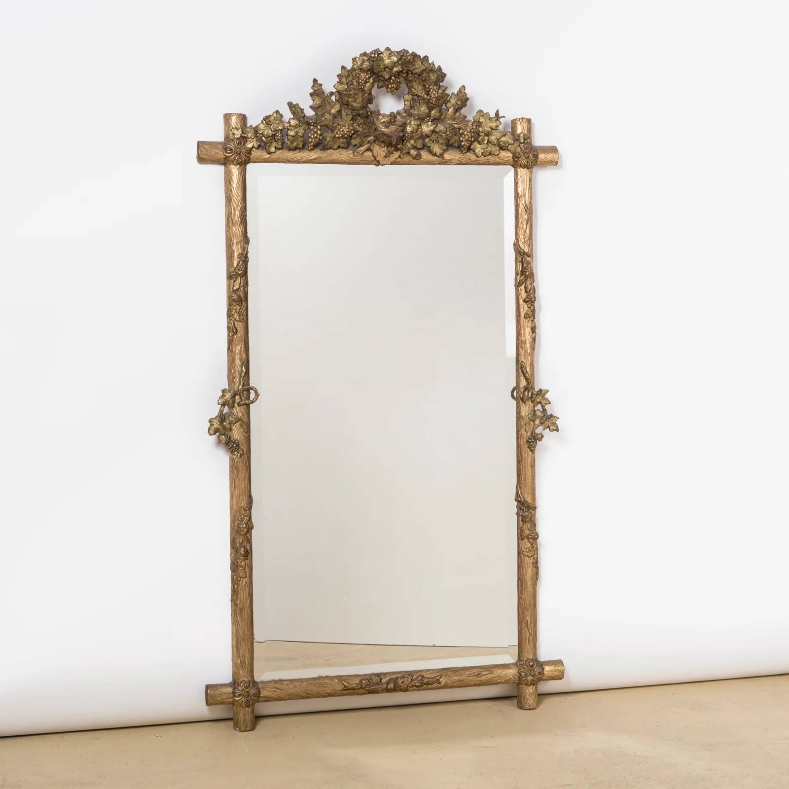 Antique faux wood mirror with bird's nest, 19th century