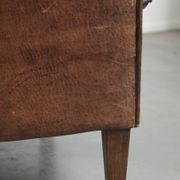 Vintage sheepskin armchair with a unique design and timeless appearance