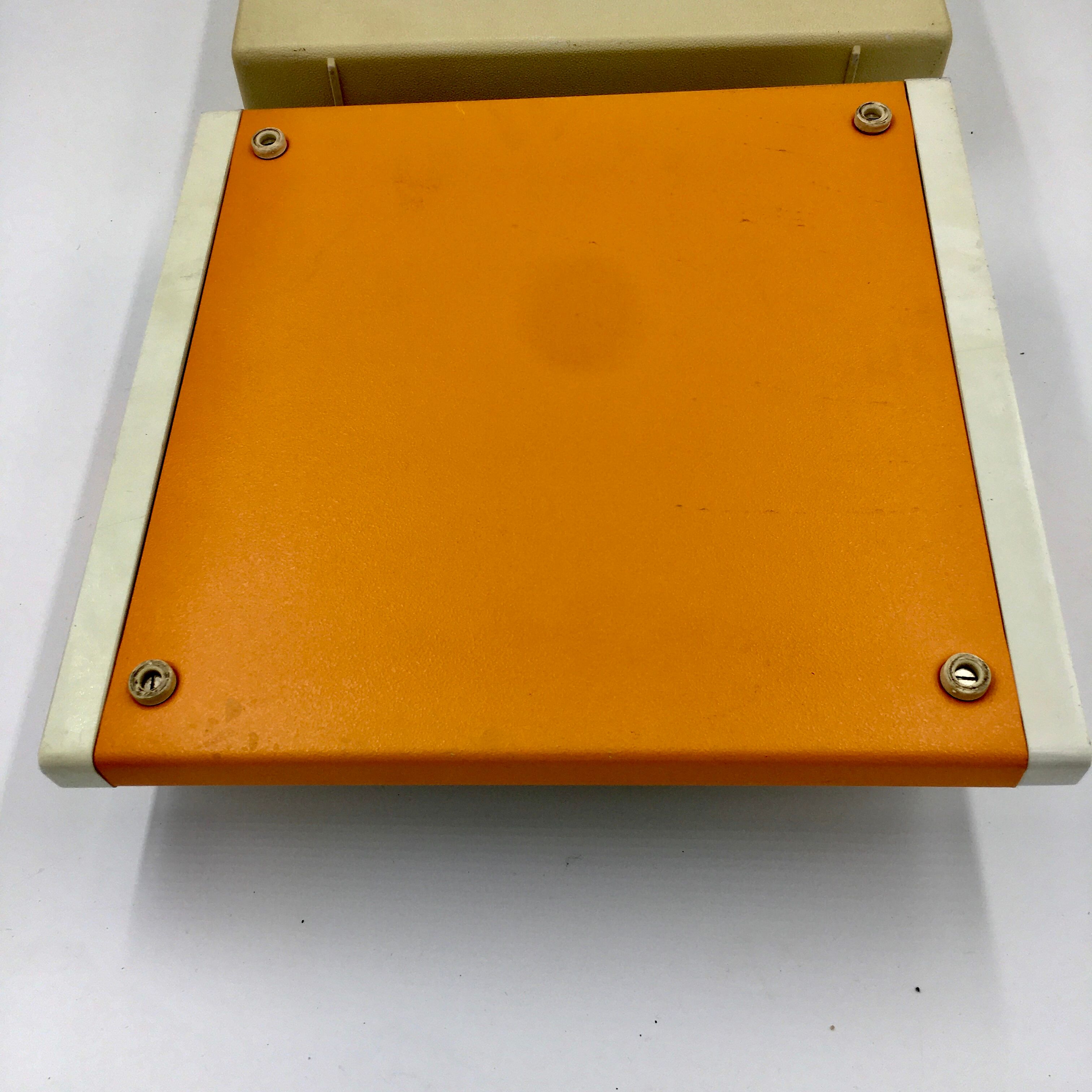 WE typewriter orange