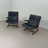 2 x Scandinavian black leather lounge chairs
