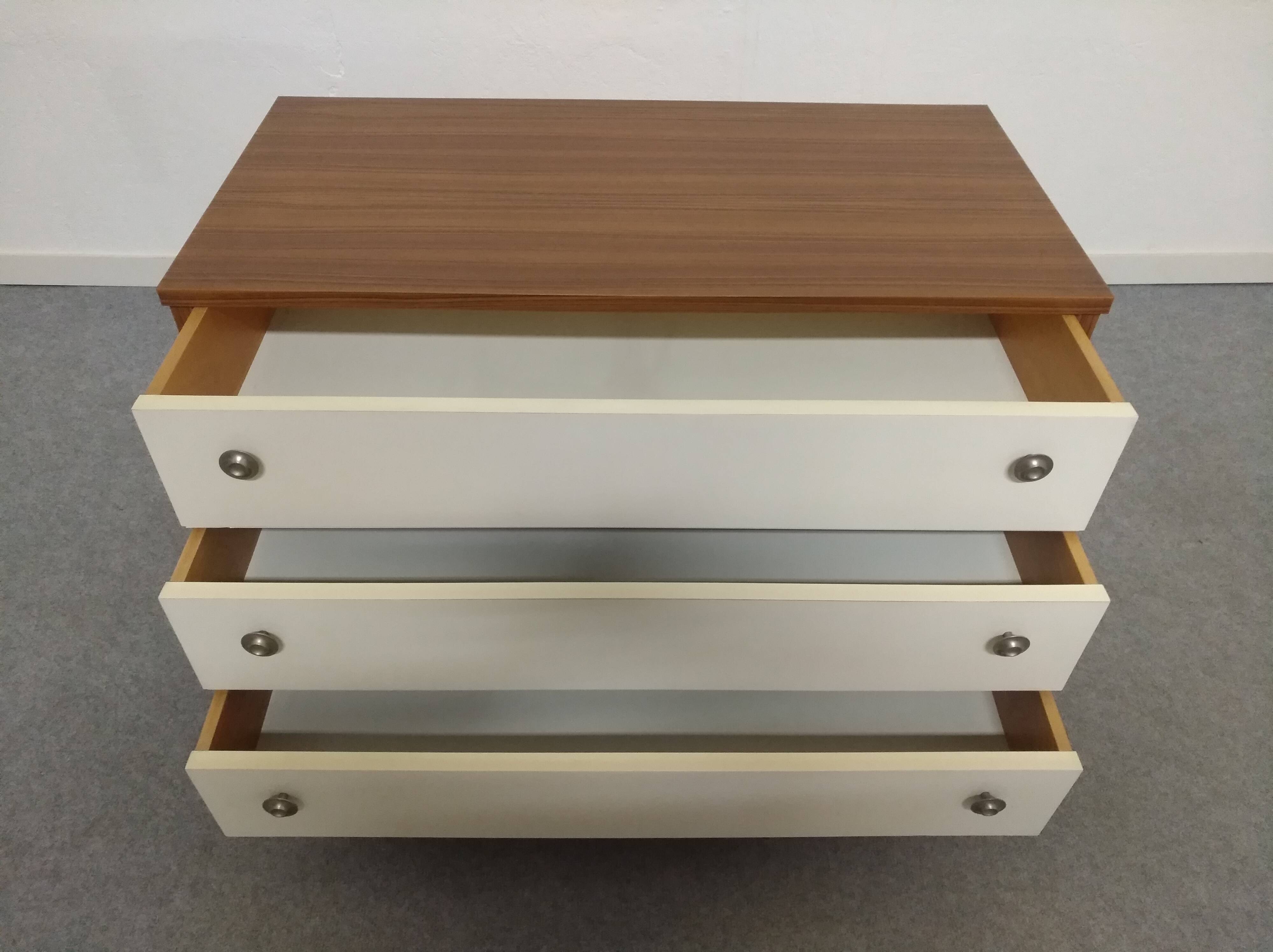 Low chest of drawers with 3 drawers in mahogany and white satin, France circa 1980.