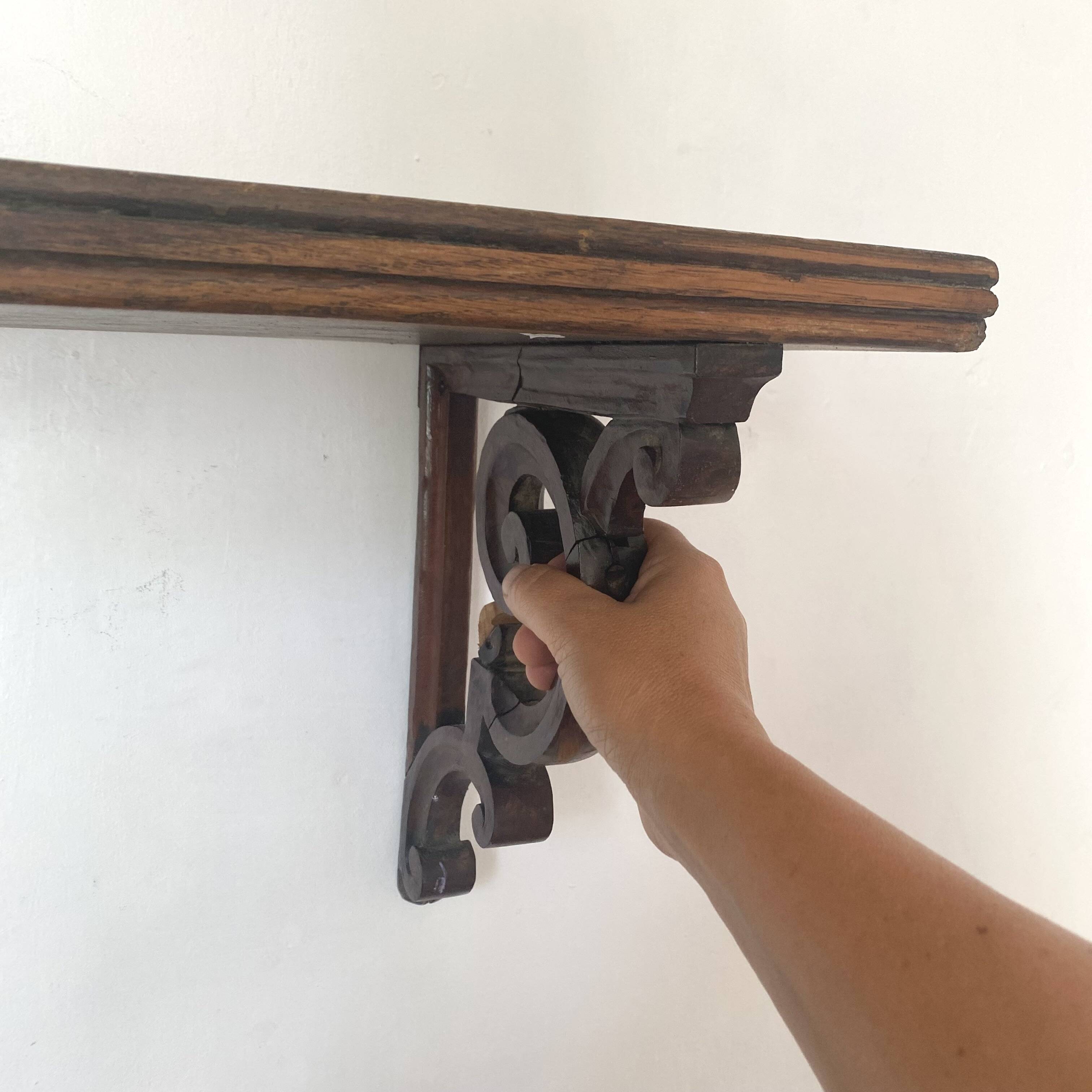 antique oak wall shelf with carved brackets