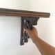 antique oak wall shelf with carved brackets