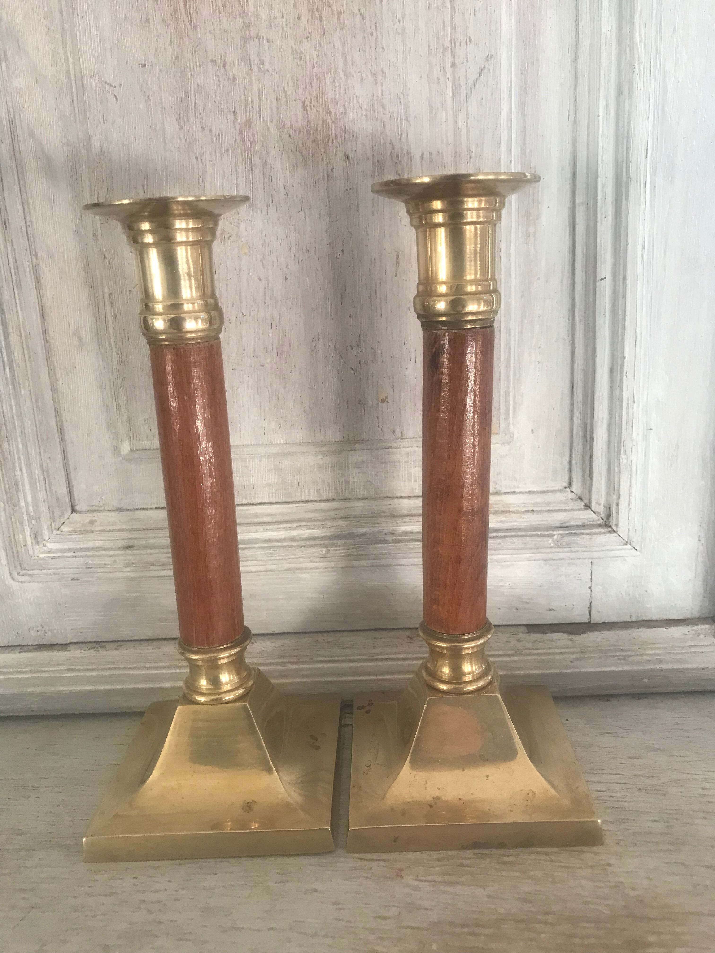 Pair of wood and brass candle holders