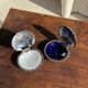 Vintage silver-plated shell butter dish with blue bowl.