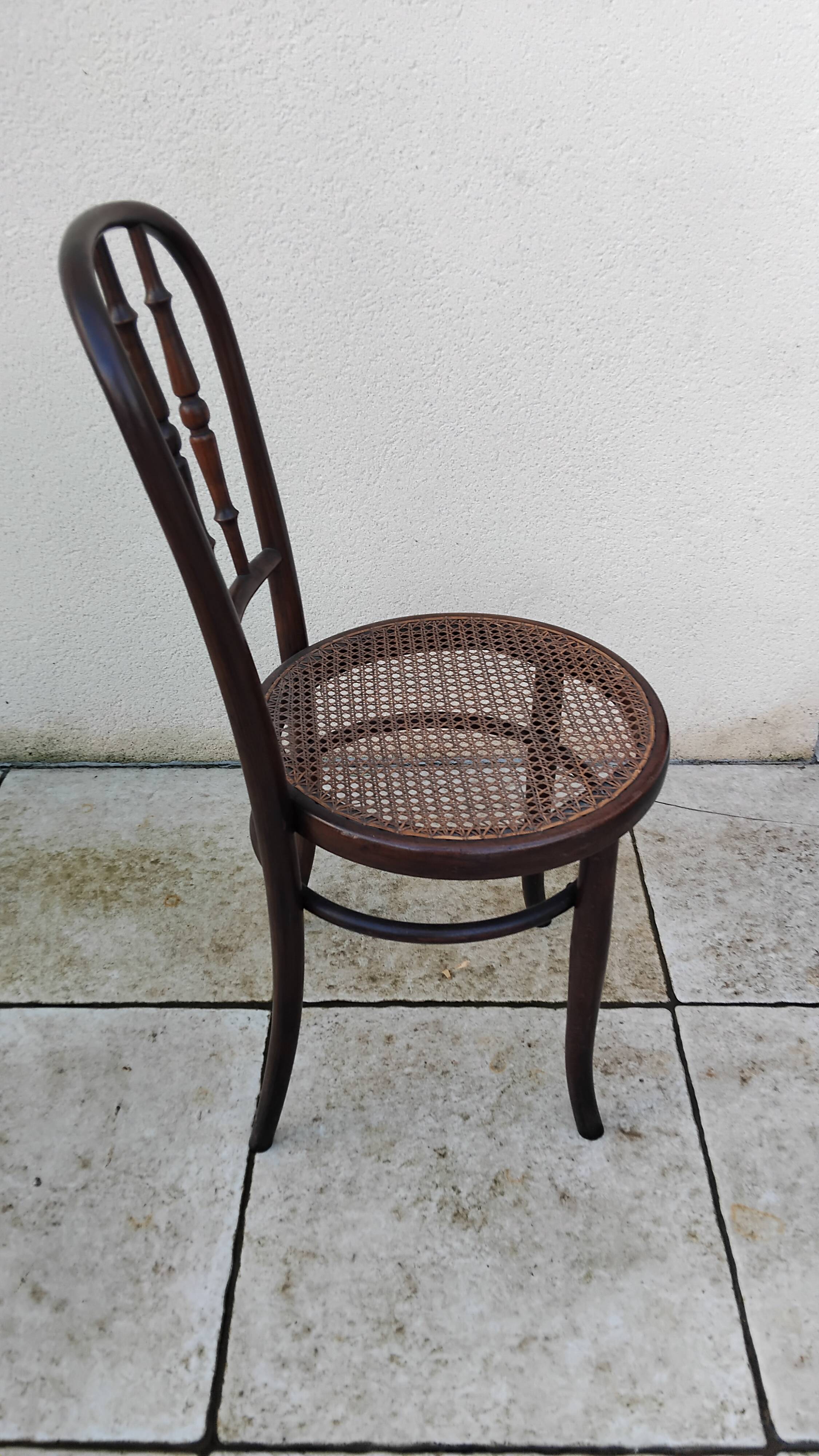Old caned bistro chair fischel
