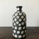 Terracotta vase painted with polka dots