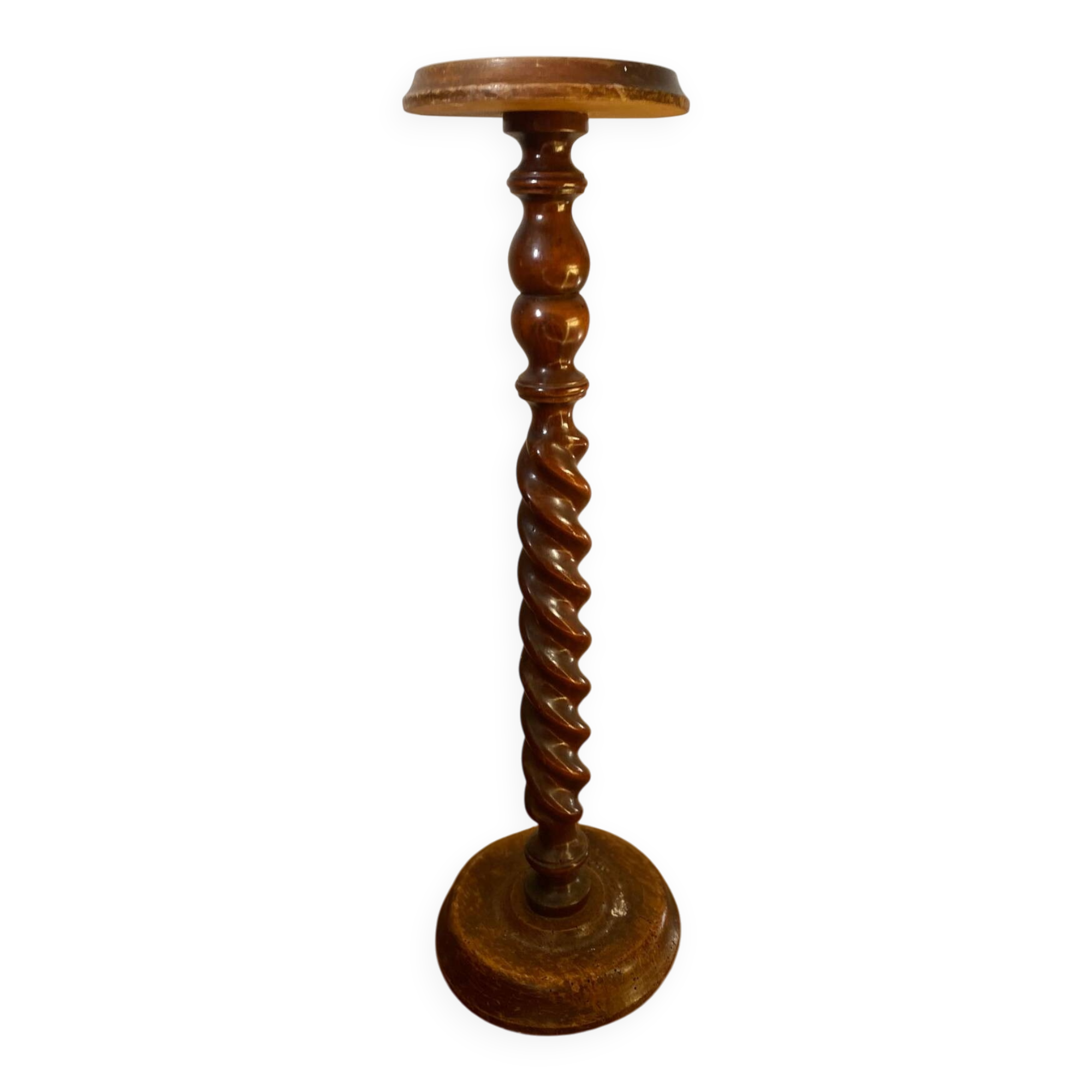 Antique pedestal table with a twisted column.