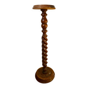 Antique pedestal table with a twisted column.