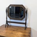 Antique beveled octagonal vanity mirror in carved wood