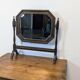 Antique beveled octagonal vanity mirror in carved wood