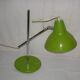 Green desk lamp with an arm from the 1970s.