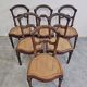 Set of 6 antique dining chairs in solid walnut, cane seats, 19th century.