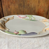 Very large serving dish with hares and vegetables.