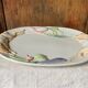 Very large serving dish with hares and vegetables.