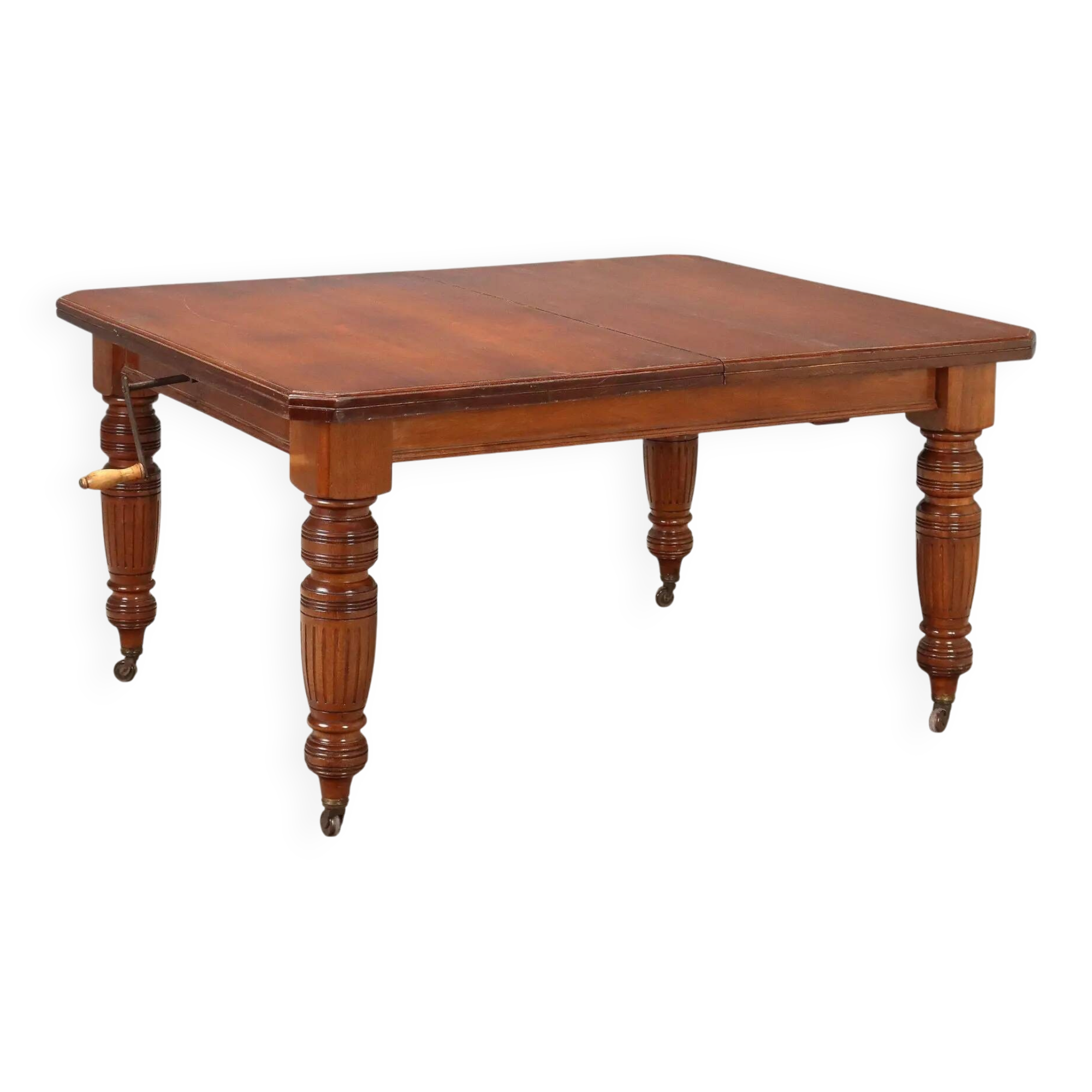 Antique extendable mahogany table with a crank mechanism, United Kingdom.