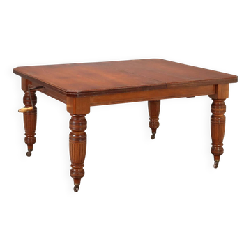 Antique extendable mahogany table with a crank mechanism, United Kingdom.