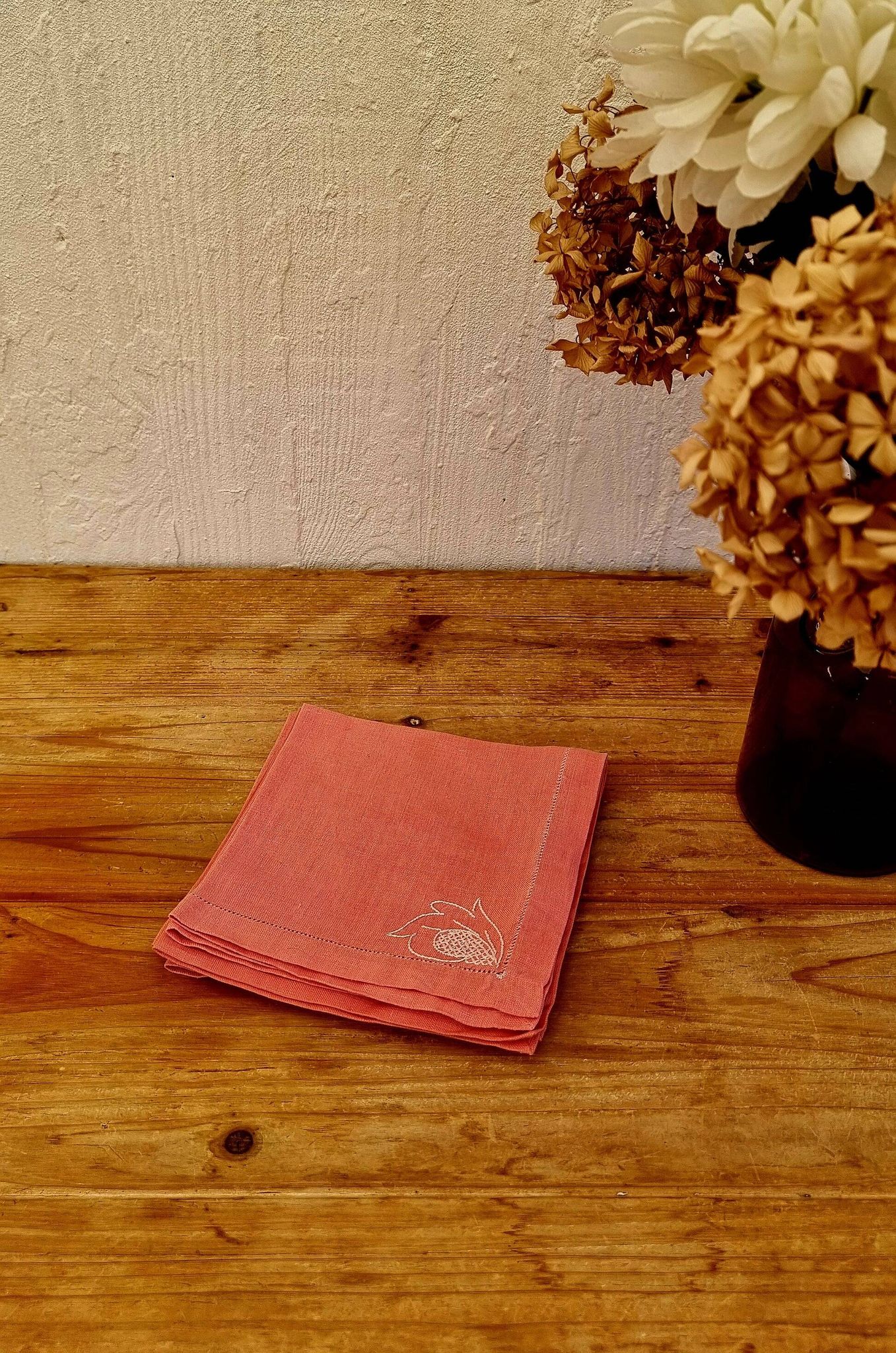 Set of 4 embroidered pink napkins.