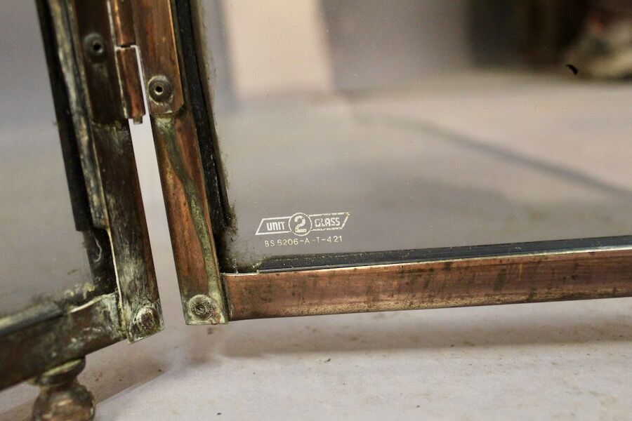Brass fire screen tinted windows