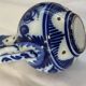 Glazed ceramic carafe with floral decoration