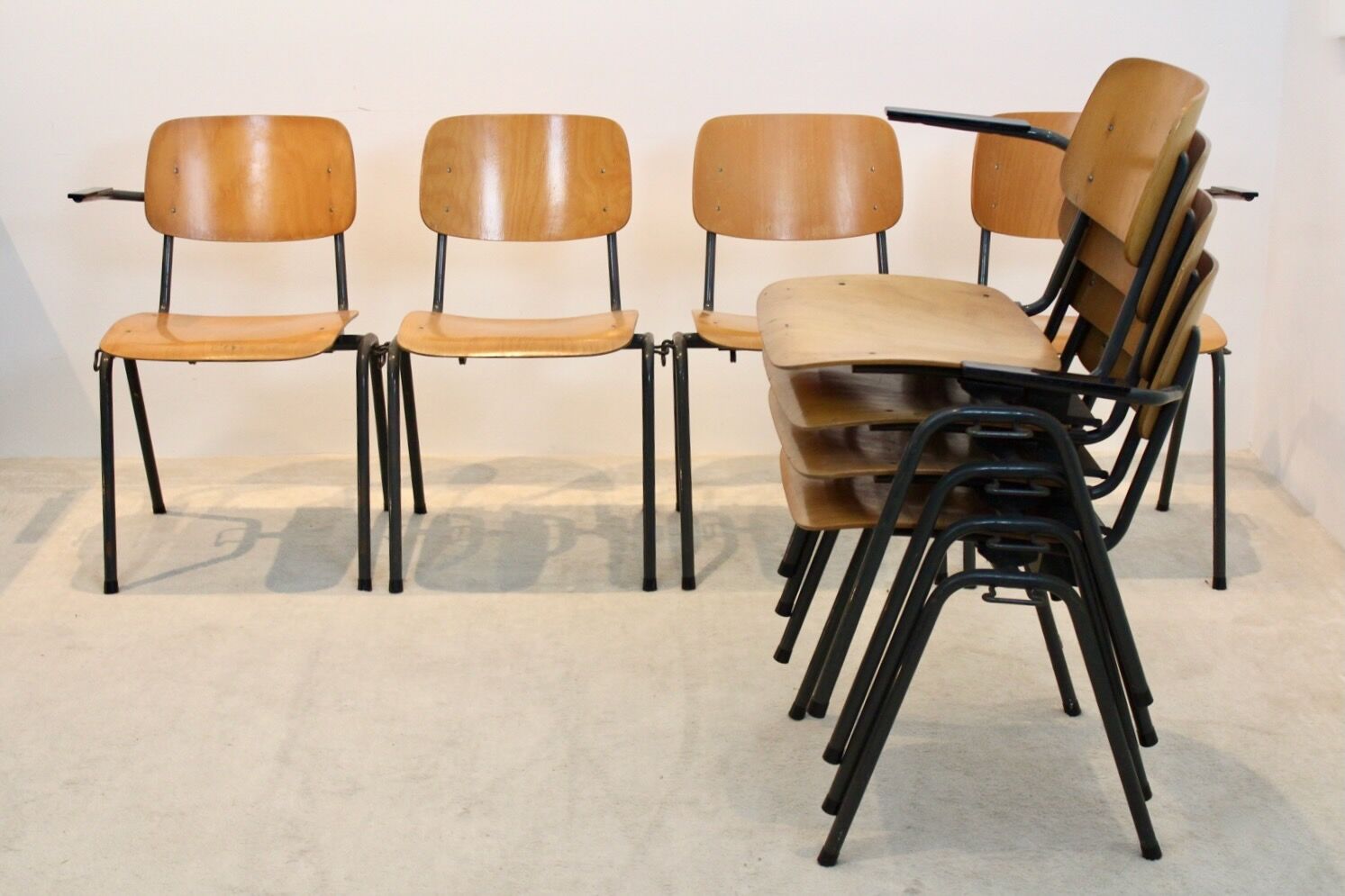 School bench consisting of 4 stackable chairs in industrial plywood by Marko Holland