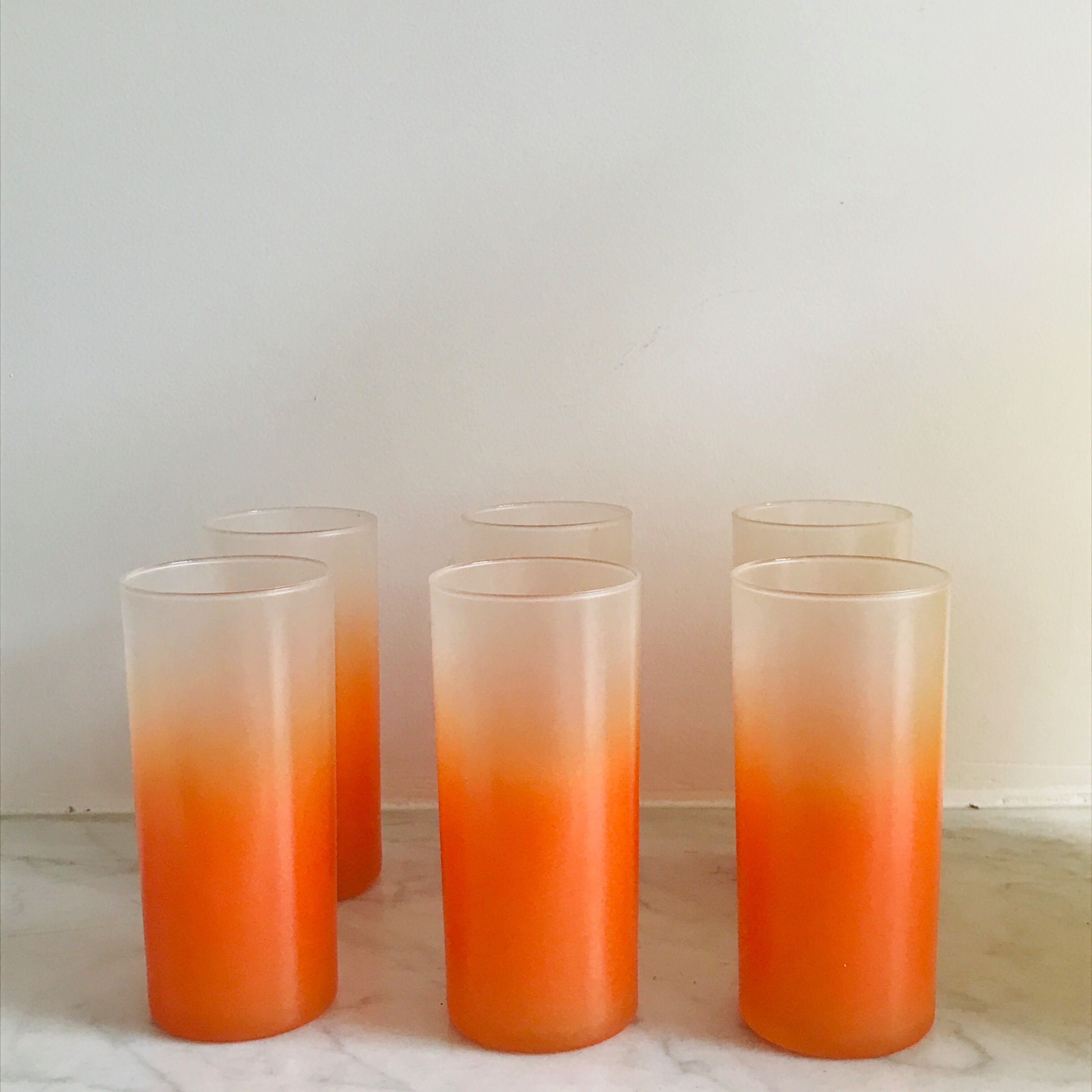 6 orangeades glasses in their basket
