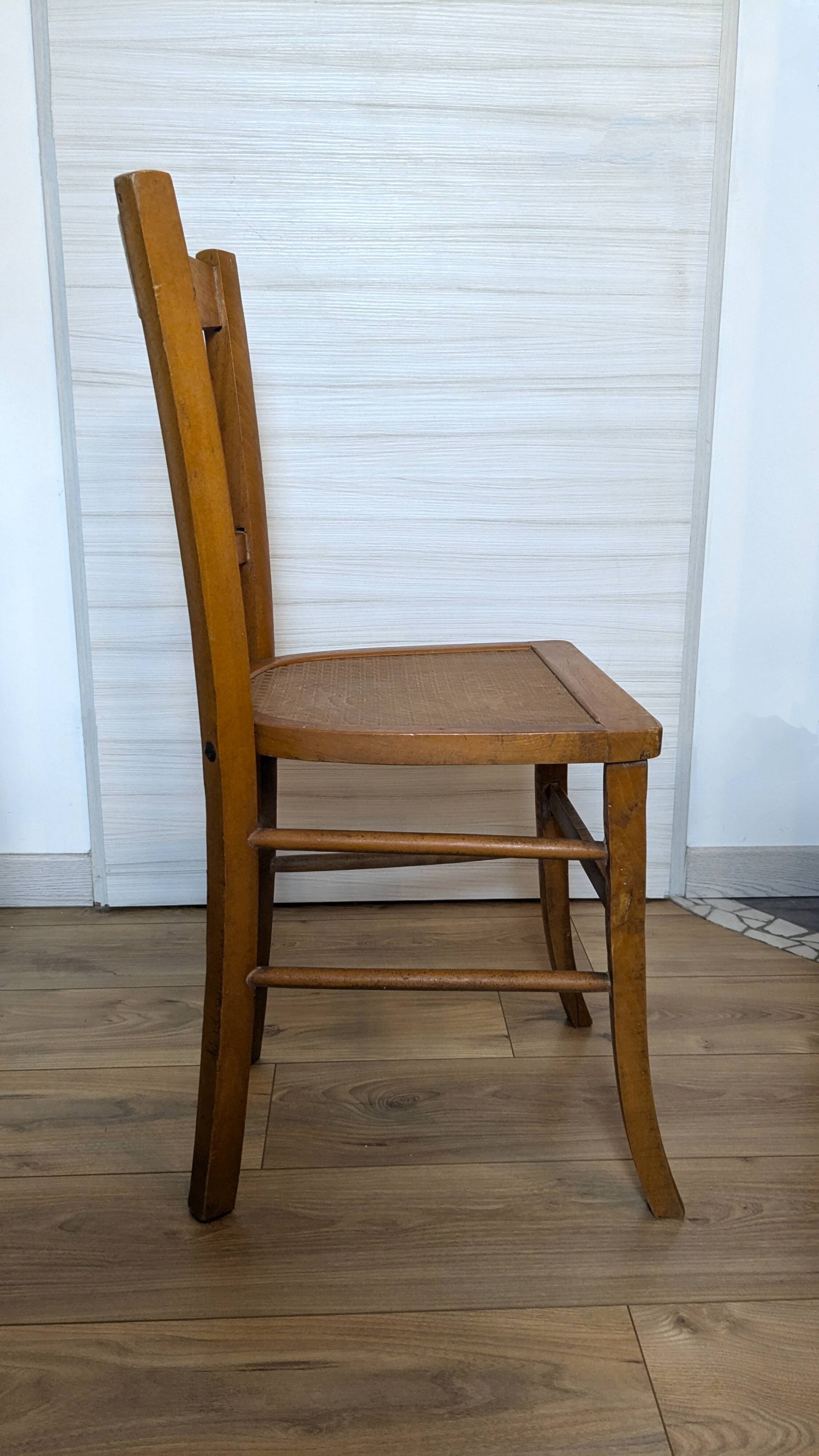 Antique patinated wooden bistro chair from the early 20th century.