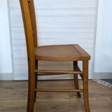 Antique patinated wooden bistro chair from the early 20th century.