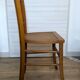 Antique patinated wooden bistro chair from the early 20th century.