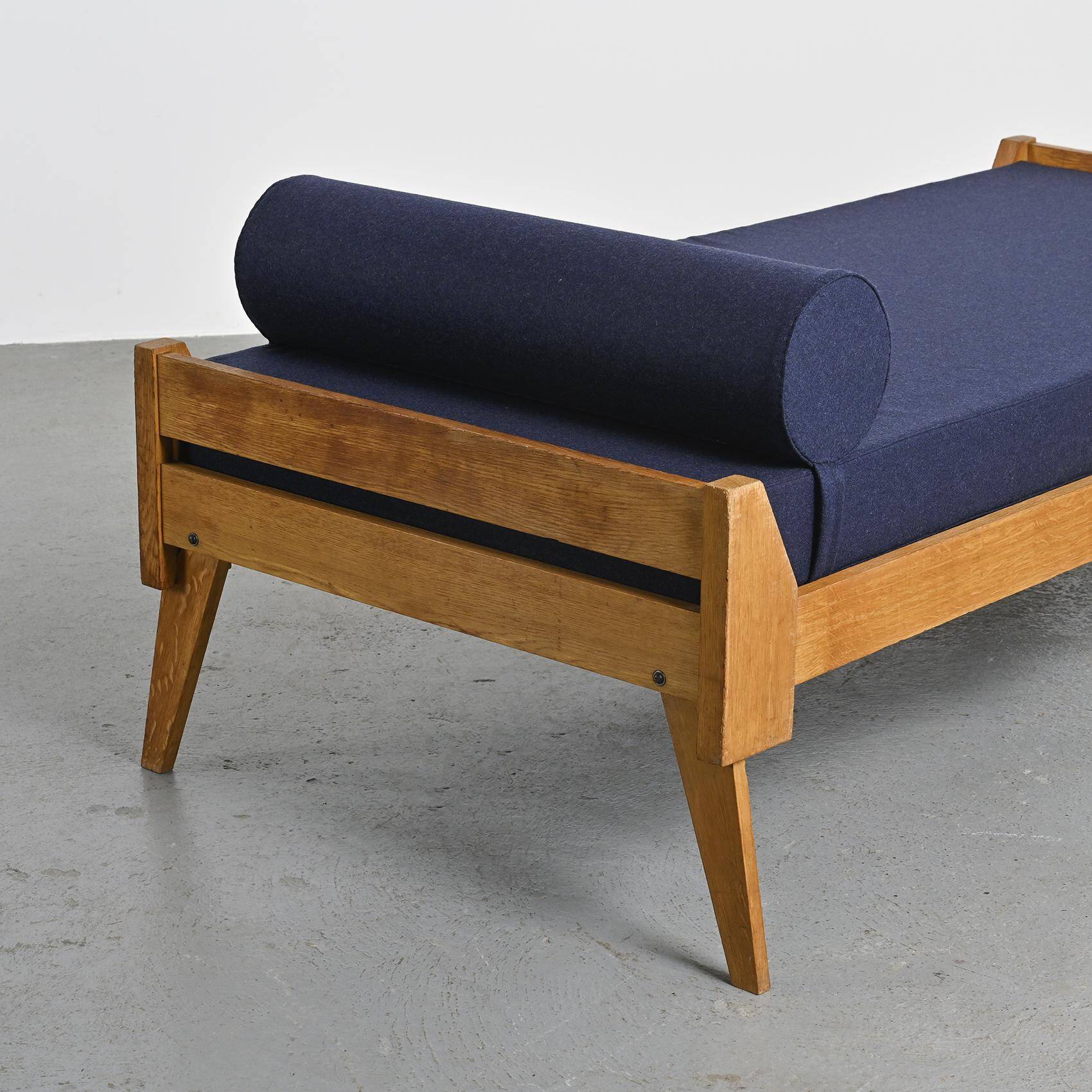 Wooden bench with midnight blue fabric, France, circa 1955