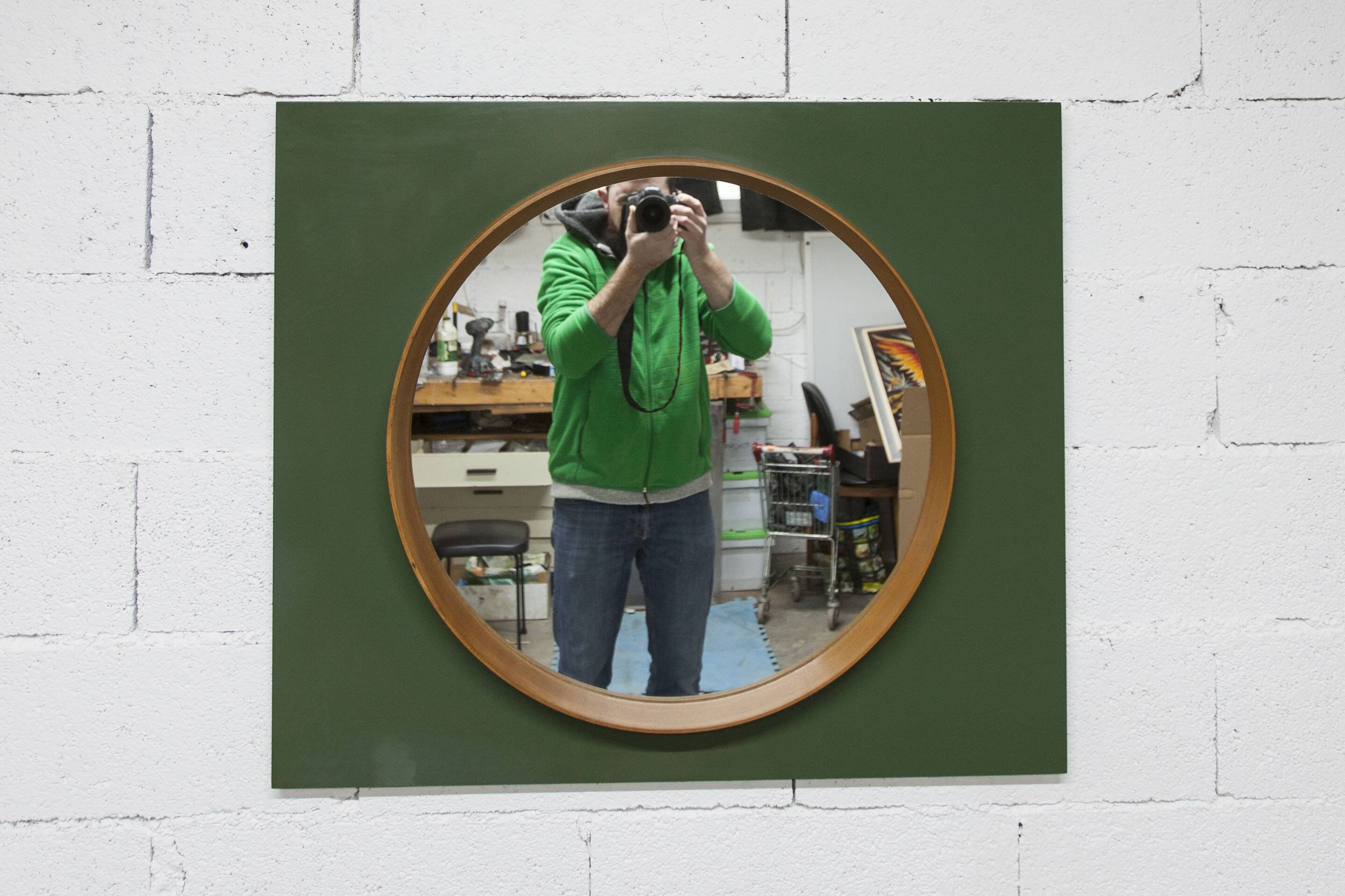 Unusual round wall mirror 60 cm teak edge on green rectangular board 1960.