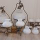 Lots of 1950s copper/ brass suspensions and wall lights with shades.