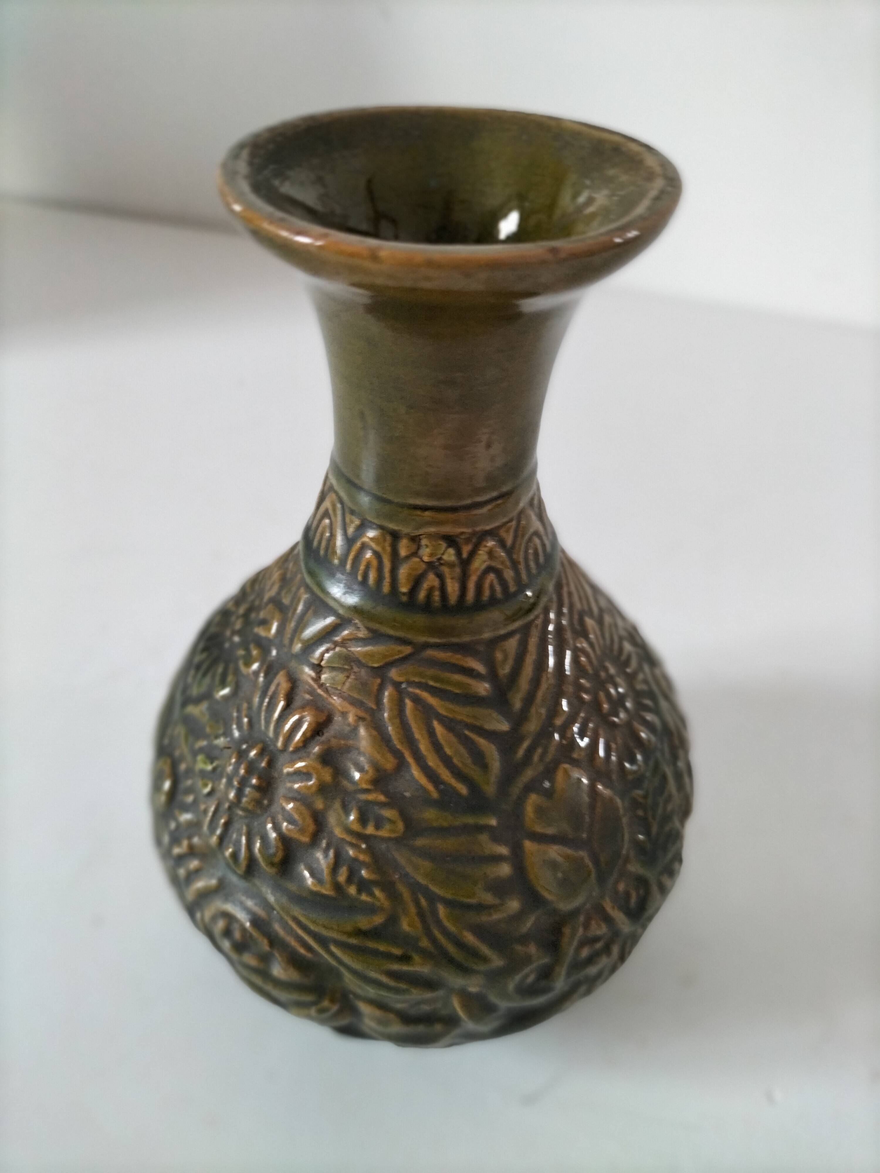Small glazed vase with raised floral decoration