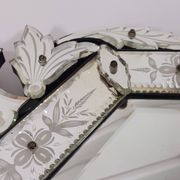 Venetian wall mirror in Murano glass with faceted floral decoration from the 1930s.