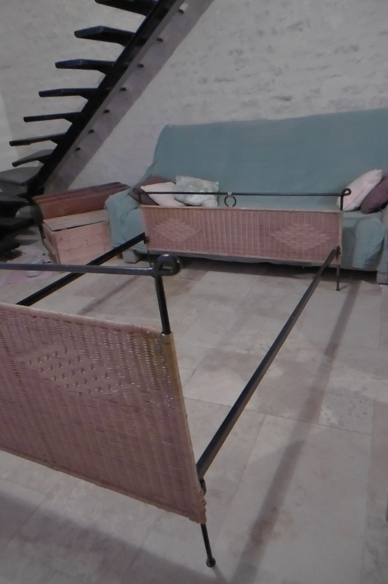 Black metal and rattan bed frame