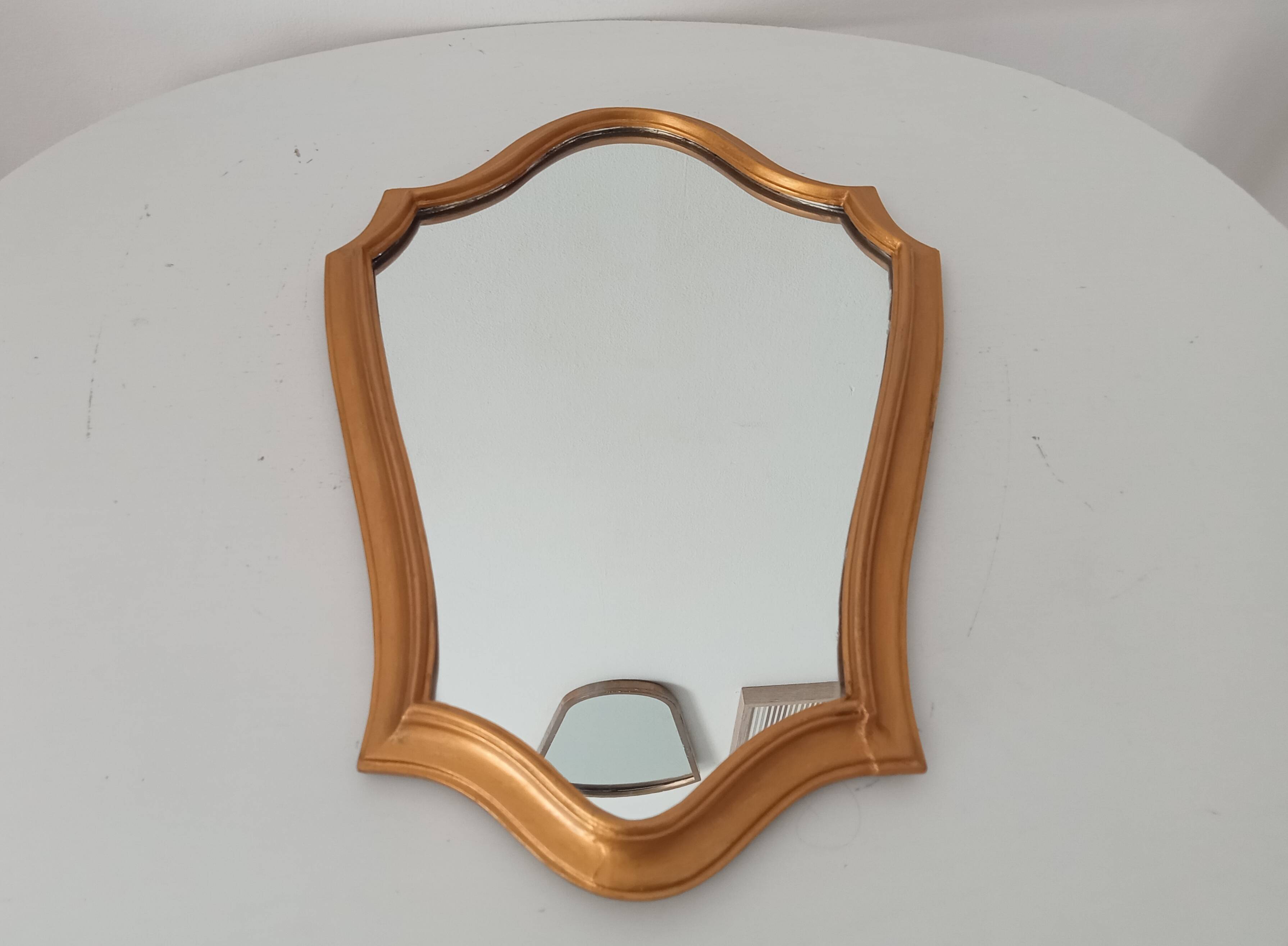 Vintage baroque mirror in gilded wood