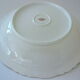 Hollow dish in white porcelain, golden lip.
