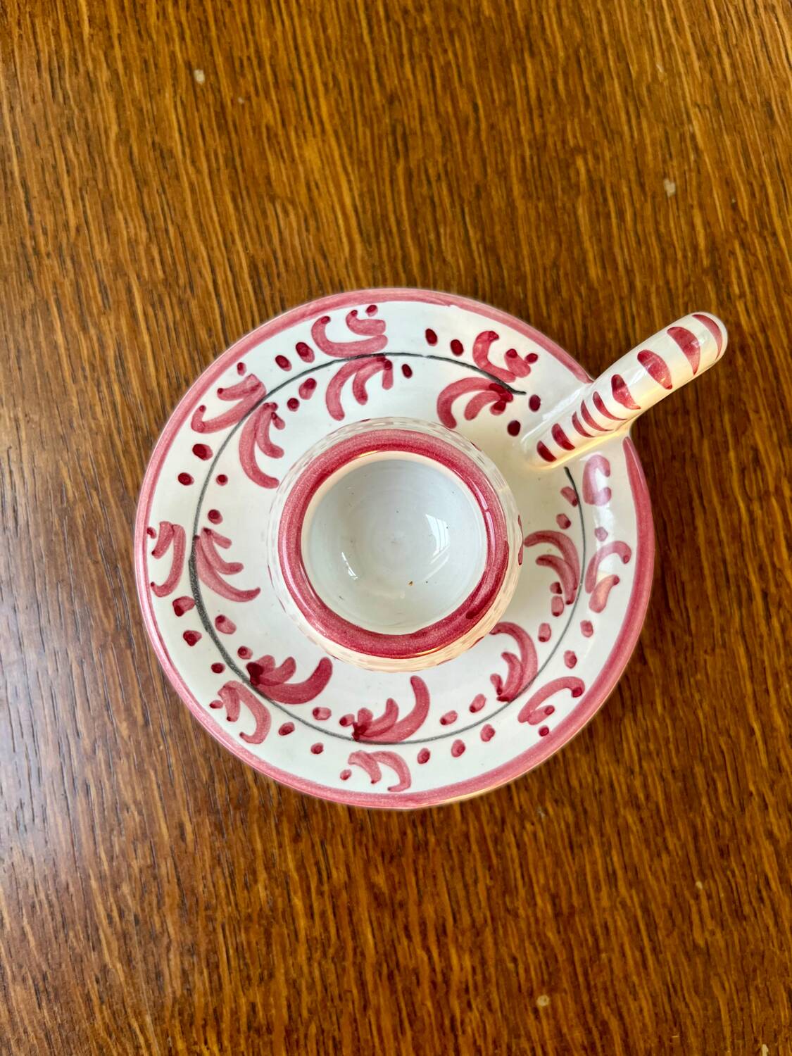 Mismatched duo of Italian ceramic candlesticks