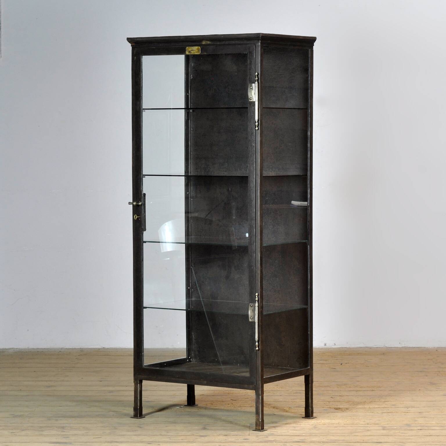 Polished iron medical cabinet, 1910s