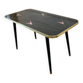 Vintage coffee table in black formica with pink accents.